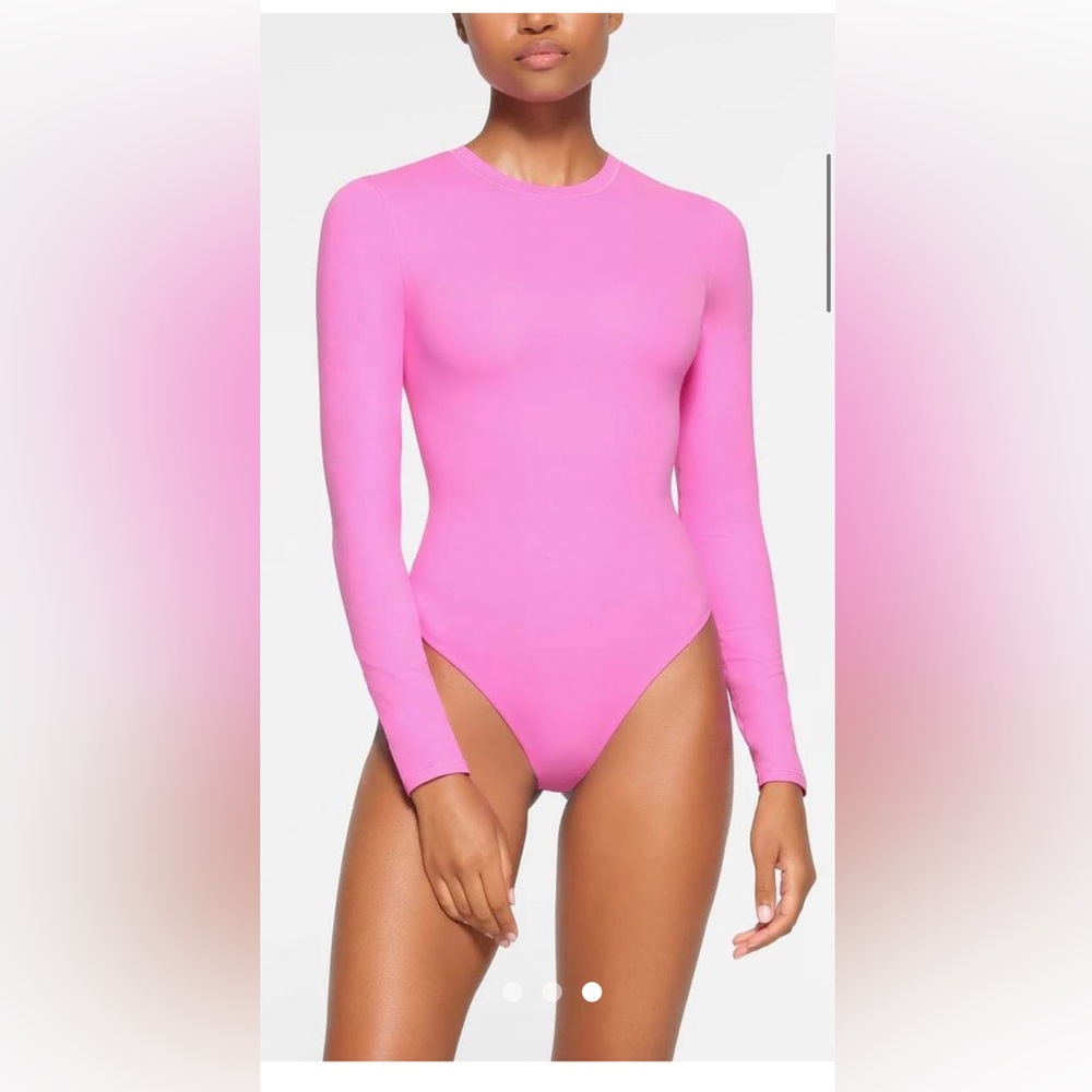 SKIMS in neon orchid pink color